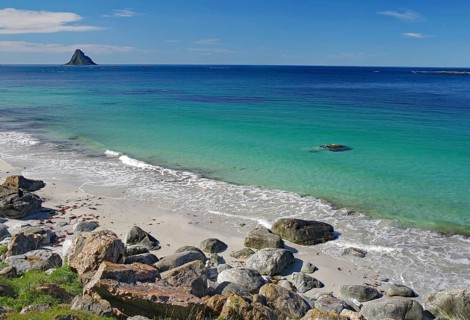 A clear day on a rocky beach with turquoise sea water, Andoeya, Bleik, Bleiksøya, Vesteralen,