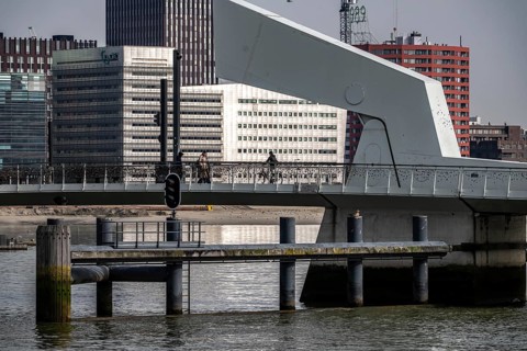 The Rijnhaven bridge over the Rijnhaven harbor basin at Kopf van Zuid, Wilhelminapier at Hotel New
