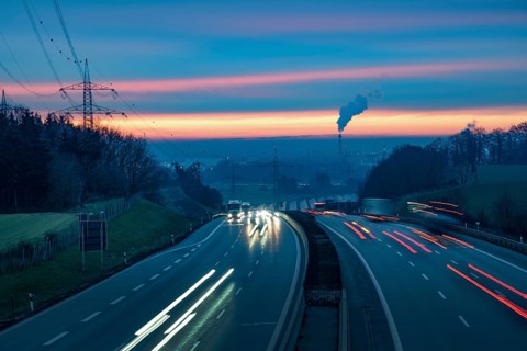 View from a bridge onto the A8 motorway near Augsburg at sunset, Augsburg, Bavaria, Germany