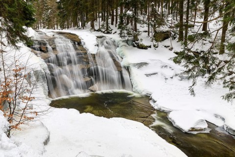 Mummel Falls in the snow, Mummel waterfall near Harrachsdorf in the Giant Mountains, Czech Republic