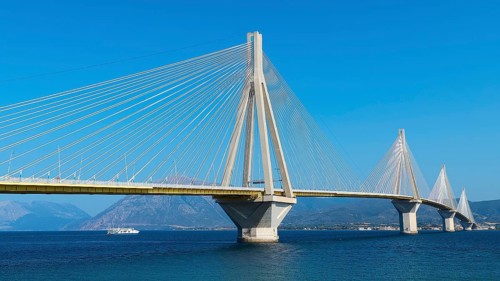 Modern bridge with turquoise water and clear sky, Rio-Antirrio cable car bridge, Patras,