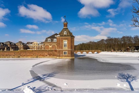 The snow-covered Nordkirchen Castle in winter, Nordkirchen, Münsterland, North Rhine-Westphalia,