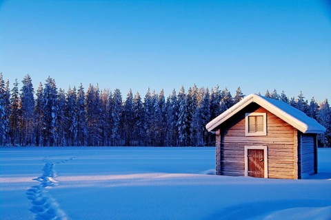 Europe, Finland, Lapland, wooden cabin in winter, winter landscape, blue sky, snowy landscape,