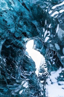 Ice cave open to the top with snow-covered ice combs, Pröng ice cave, Sudurland, Iceland