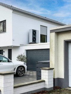 Heat pumps on the garage roof of a detached house in Hilden, Germany