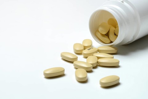 Tablets in plastic containers, health care, symbolic picture