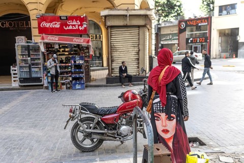 Cairo, Egypt. April 3rd 2025. An Egyptian Muslim woman wearing a red hijab head covering and