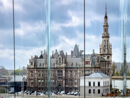 Historic Loodswezen building (pilot house) on the Scheldt, view through a glass pane of the MAS