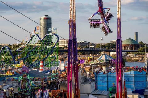 Rhine fair in the Rheinwiesen in Düsseldorf-Oberkassel, view towards Oberkassler Brücke, rides,