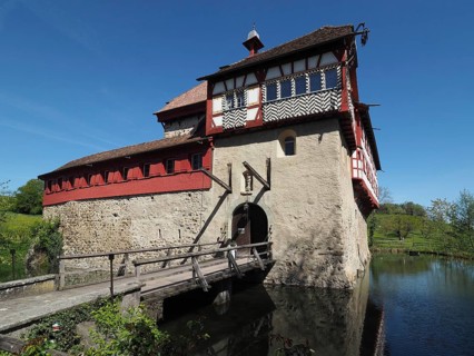 Timbered structure on a castle with wooden drawbridge and moat, Hagenwil moated castle, Hagenwil,
