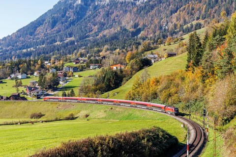 Railjet railway passenger train of the Austrian Federal Railways ÖBB on the Arlbergbahn in autumn