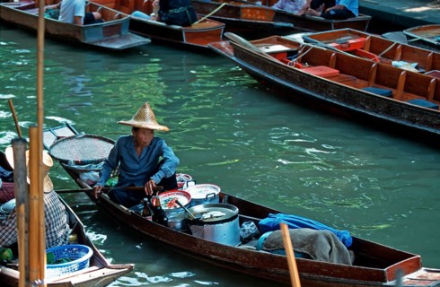 Merchant in her boat at Damnoen Saduak Floating Market, Thailand, December 2002, vintage, retro,