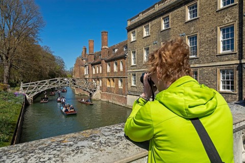 Punting, woman photographed, punting, Mathematical Bridge, Queens' College, River Cam, Cambridge,