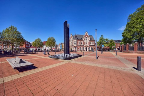 City center, Black Fountain water feature, benches, public seating area, residential and commercial