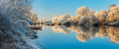 Landscape on the river Eder in winter, trees covered with hoarfrost, reflection in water, near Bad