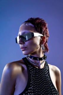 A striking portrait of a cyberpunk woman with edgy sunglasses, sporting bold accessories and a