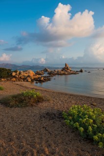 Lonely beach with granite rocks, sunrise, Spiaggia Poltu Manzu, Capo Ceraso, near Olbia, Sardinia,