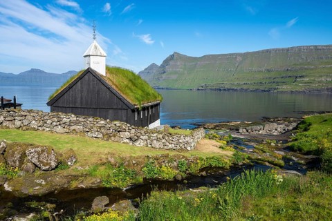 Funningur wooden church, church with grass roof on the fjord, Eysturoy island, Faroe Islands,