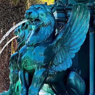Fonte dos Leões by artist Emmanuel Fremiet, lion fountain in backlight, historic landmark, detail,