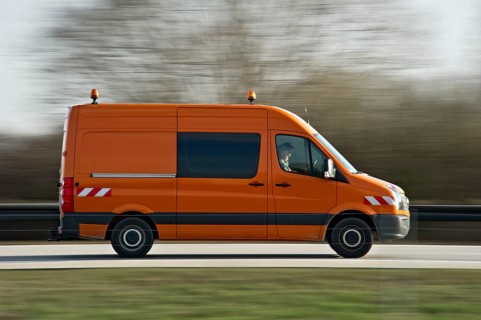 Road maintenance van driving fast on the A92 motorway, motion blur, wiping effect, Freising, Upper