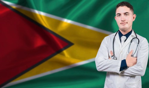 Portrait of medical professional on Guyana flag background.Guyanese national health system