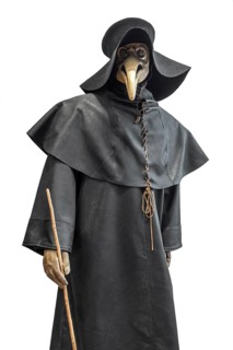 Black wide-brimmed hat, overcoat and beaked mask for plague doctor to treat victims of bubonic