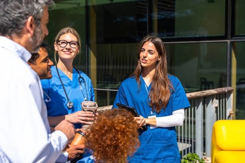 Group of multi ethnic medical students and healthcare professionals discussing and learning