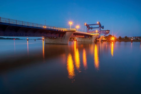 Lift bridge over the Peene Stream to the island of Usedom at dusk, blue hour, Wolgast,