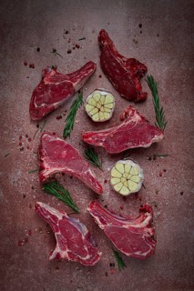 Fresh, raw calf ribs, with spices, top view, no people