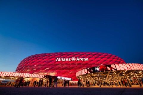 Visitors, fans, entrance area of the Allianz Arena, illuminated, overview, blue hour, in front of a