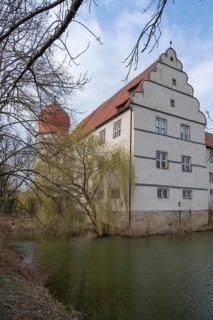 Moated castle, originally a manor house, converted into a Renaissance castle between 1612 and 1618,