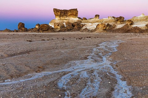 Striking rock formation in the Huqf stone desert in the morning light, at blue hour, Arabian