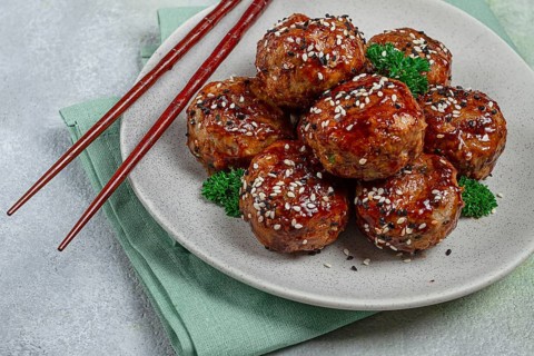Tsukune, Japanese meatballs, minced chicken, fried on a skewer, with yakitori sauce, homemade, no