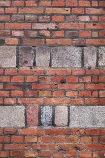 Wall with red bricks and hewn natural stone, Copenhagen, Denmark
