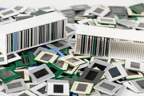 Two slide holders with different slides in the middle of a chaotic heap