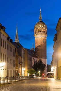 Coswiger Straße in the evening with castle church tower, Luther city Wittenberg, Saxony-Anhalt,