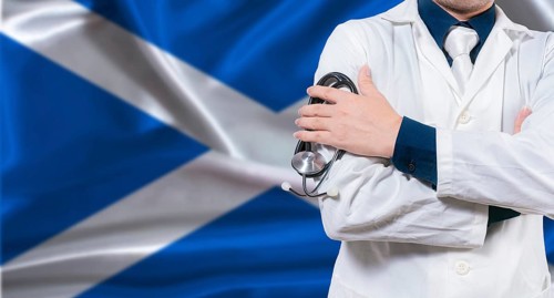 Scottish national health system, Medical professional holding sthetoscope isolated