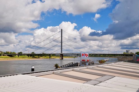 Düsseldorf, Germany - June 9th 2026: View on 'Oberkasseler Brücke' bridge from Riverside promenade