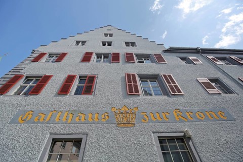 Historic Gasthaus zur Krone built in 1505 with stepped gable, view upwards, yellow, golden,