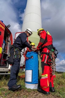 Height rescuers from the Gelsenkirchen fire brigade practise abseiling from a wind turbine from a