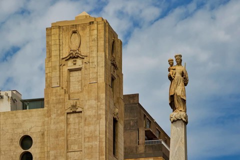 Statue in front of a historic building under cloudy sky, capital city, Santa Cruz de Tenerife,