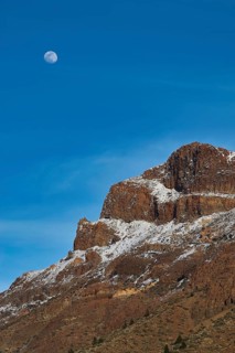 Moon over a snowy mountain peak under clear blue sky, Teide, Parque Nacional del Teide, Teide