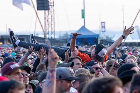 Adenau, Germany, 7 June 2024: Fan crowdsurfing at Rock am Ring. The festival takes place at the