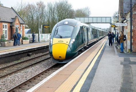 GWR British Rail Class 800 Inter City Express train arriving at railway station platform, Pewsey,