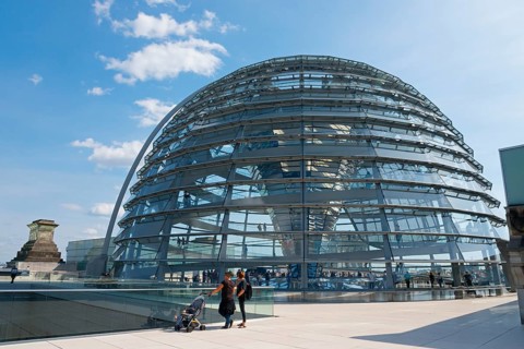 Glass dome of the Reichstag building with visitors in sunny weather, Reichstag building, German