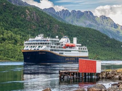 Havila voyages, alternative provider on the Hurtigruten route, cruise ship passing the Raftsund,