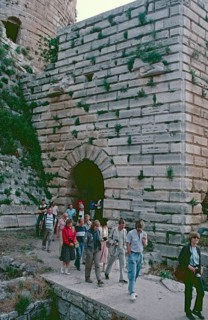 Tourists, Pentagonal tower on the south side of the castle, Krak des Chevaliers, Homs, Syria, May