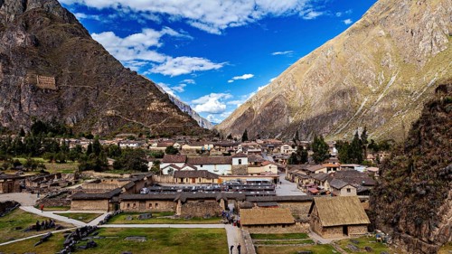 Traditional settlement in the valley between big mountains and blue skies, The Inca ruins of