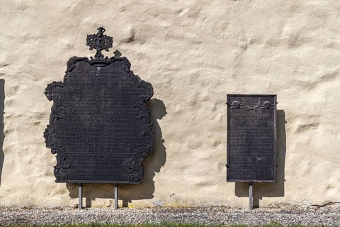 Epithaphs, cast-iron grave inscriptions on the monastery wall in Königsbronn. The elaborately