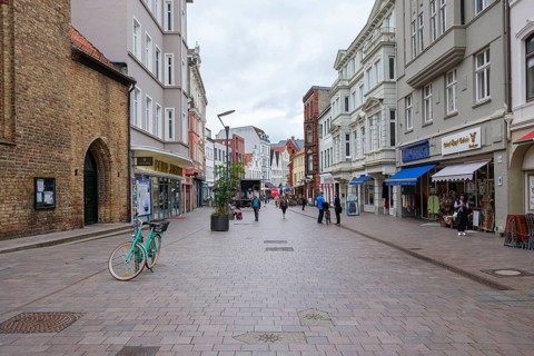 Busy shopping street with people and shops, Flensburg, Schleswig-Holstein, Germany